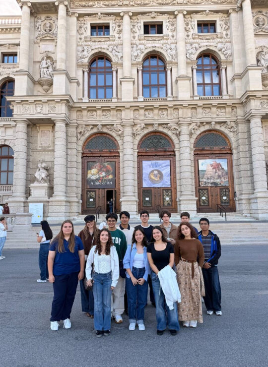 Our students gather for a wide group portrait in front of the museum’s grand stone façade and entrance steps.