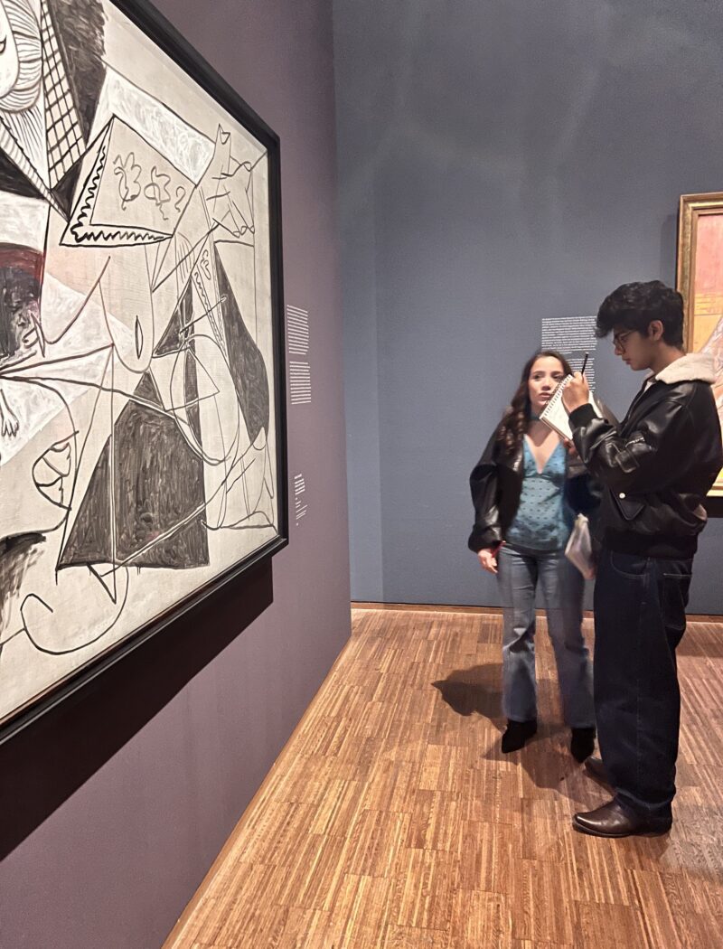 Two Schloss Krumbach IB Visual Arts students studying a cubist portrait by Pablo Picasso at the Albertina Museum in Vienna.