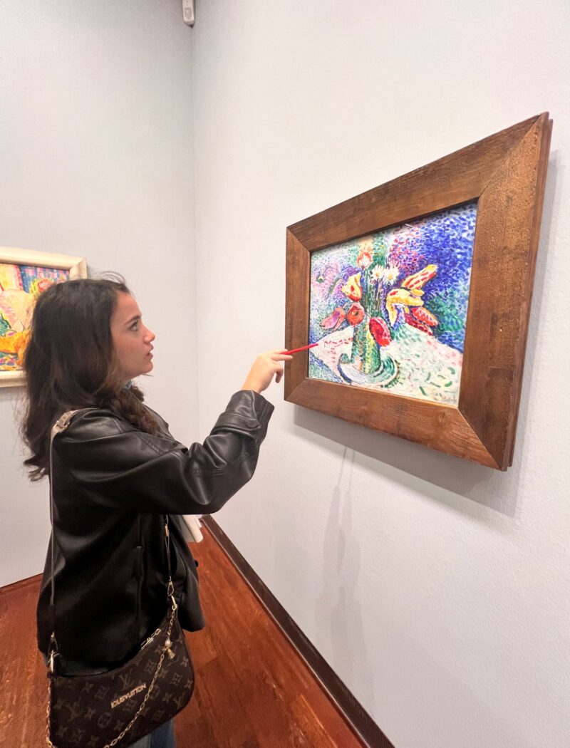 Schloss Krumbach IB Visual Arts student examining a colorful floral painting by Henri Matisse at Vienna's Albertina Museum.