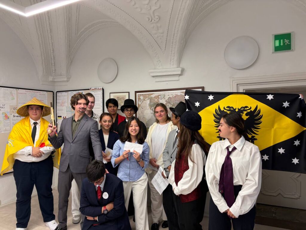Schloss Krumbach International School students in historical costumes participating in a World War I diplomatic role-playing activity.
